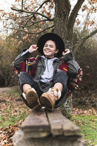 Portrait of smiling girl on tree