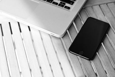 High angle view of laptop and mobile phone on table