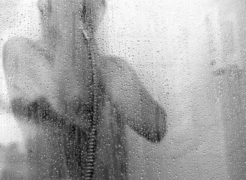 Close-up of wet window in rainy season