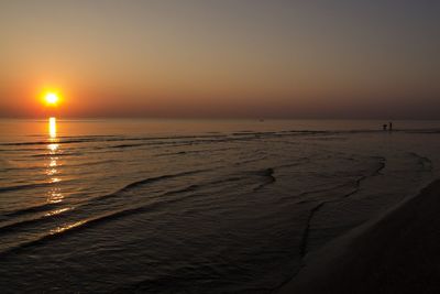 Scenic view of sea at sunset