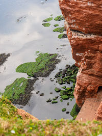 High angle view of rock formations at beach