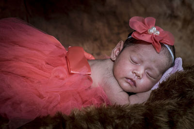 Portrait of cute girl sleeping on bed