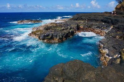 Scenic view of sea against sky and a rocky ocean coast 