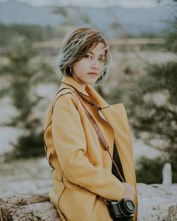 Portrait of woman standing outdoors