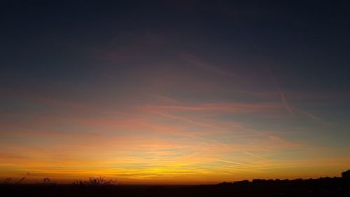 Scenic view of dramatic sky during sunset