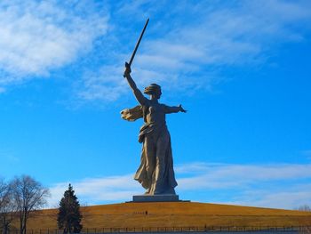 Low angle view of statue against sky