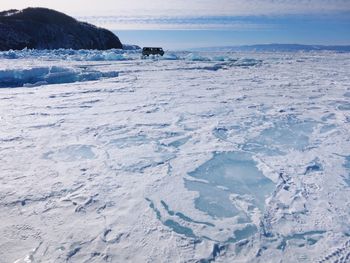 Scenic view of frozen sea against sky