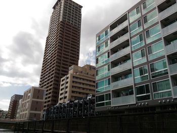 Low angle view of buildings against sky in city