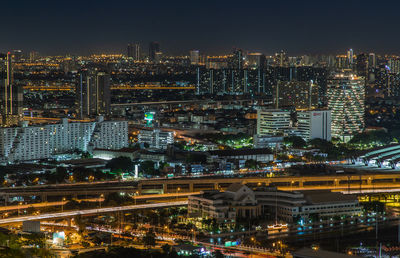 High angle view of illuminated city buildings at night