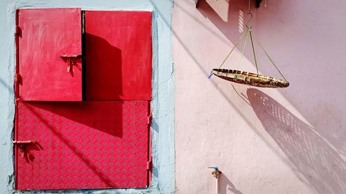 Close-up of a red flag on wall