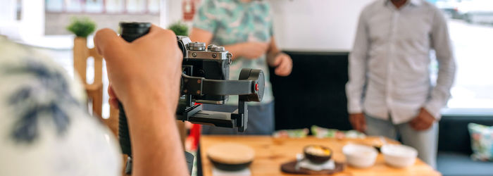 People recording video in restaurant