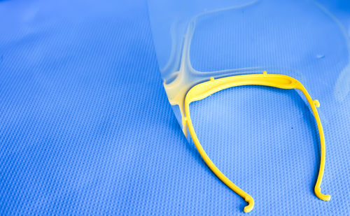 High angle view of yellow ring on table