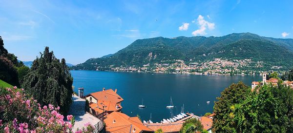 Panoramic shot of city by sea against sky