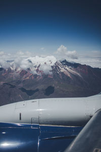 Aerial view of mountain range against sky