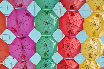 Full frame shot of multi colored umbrellas against sky