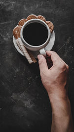 High angle view of black coffee cup on table