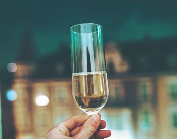 Close-up of hand holding glass of wine