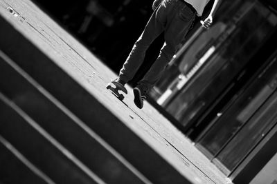 Low section of man skateboarding at park