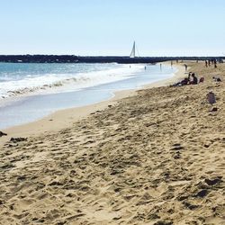 Scenic view of beach against clear sky