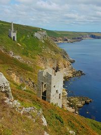 Historic building by sea against sky