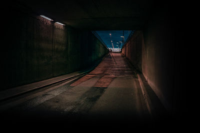 Empty road amidst buildings