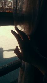 Close-up of hand in sea