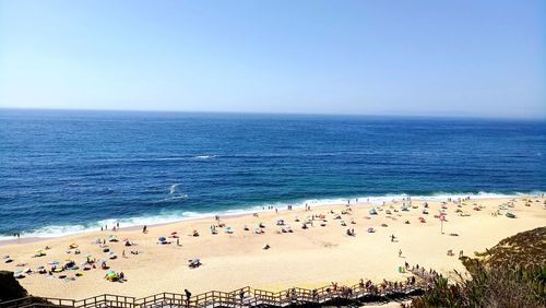 High angle view of people on beach against sky