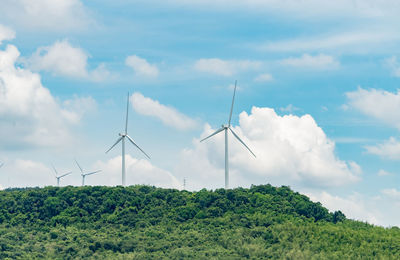 Low angle view of windmill against sky