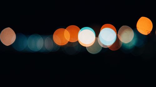 Close-up of colorful lights against black background