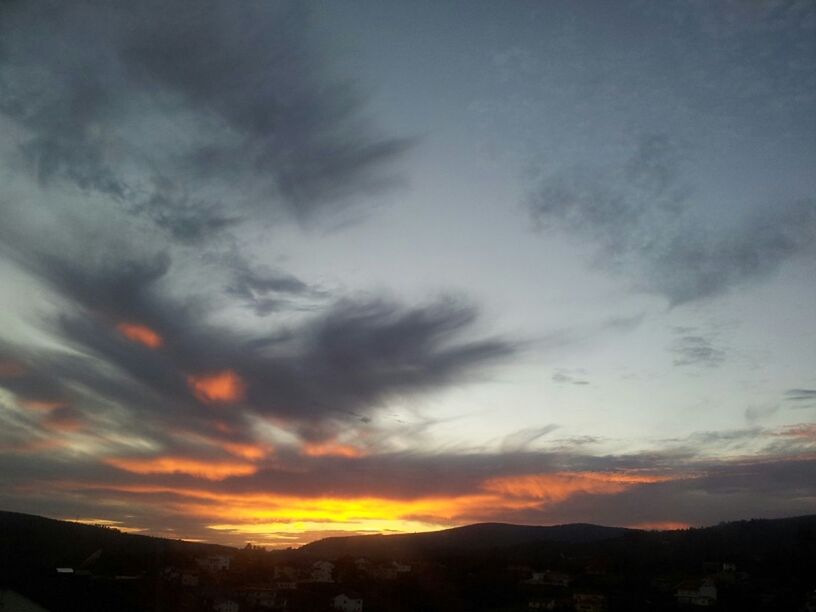 sunset, sky, cloud - sky, scenics, silhouette, beauty in nature, building exterior, orange color, built structure, tranquil scene, mountain, architecture, landscape, tranquility, nature, cloud, dramatic sky, idyllic, cloudy, outdoors