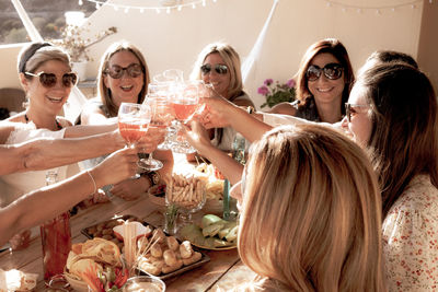 Group of female friends toasting wineglasses