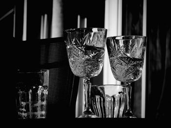 Close-up of wine glasses on table