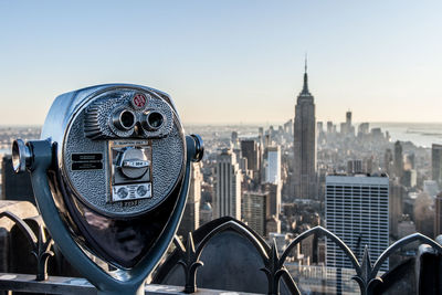 View of modern cityscape against clear sky