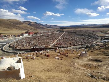 Aerial view of people on landscape against sky