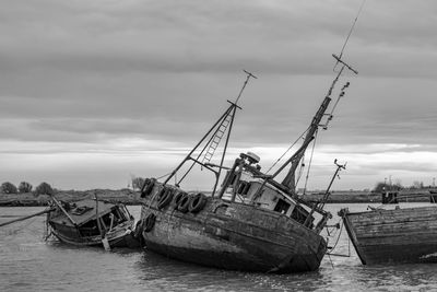 Boats moored at harbor