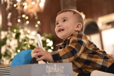 Portrait of cute boy looking away