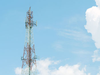 Low angle view of communications tower against sky