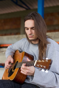 Young man playing guitar