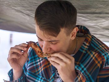 Portrait of man eating food
