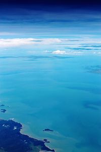 Scenic view of sea against blue sky