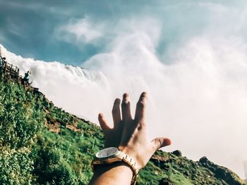 Low angle view of man in sea against sky