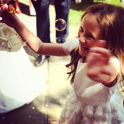 High angle view of girl with arms raised