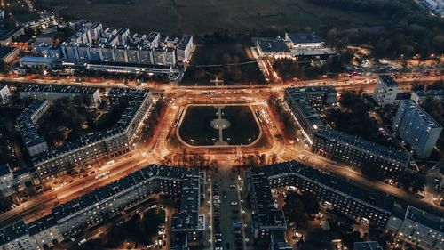 High angle view of city lit up at night