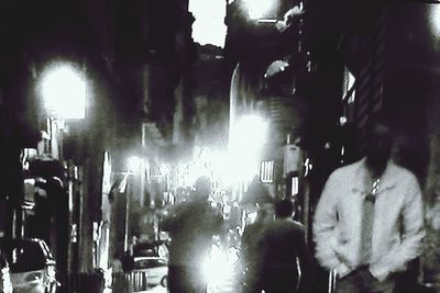 Lit candle in dark room