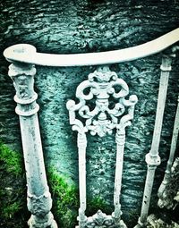 Close-up of wooden railing in water