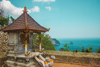 Religious building, traditional balinese temple on the background of the ocean. bali, indonesia