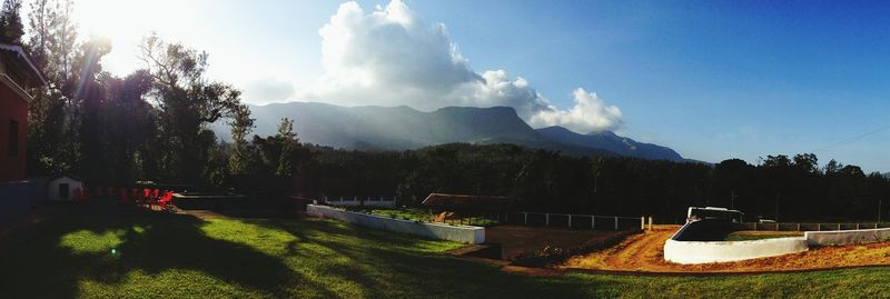 Panoramic view of trees and mountains against sky