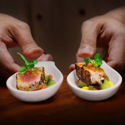 Close-up of man holding food in plate