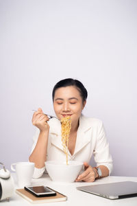 Young woman holding coffee cup