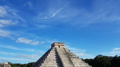 Low angle view of historical building against blue sky